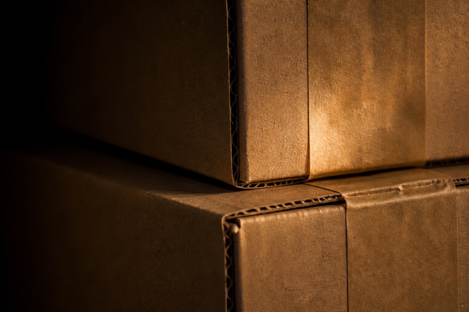 Close detail of stacked kraft shipping cartons